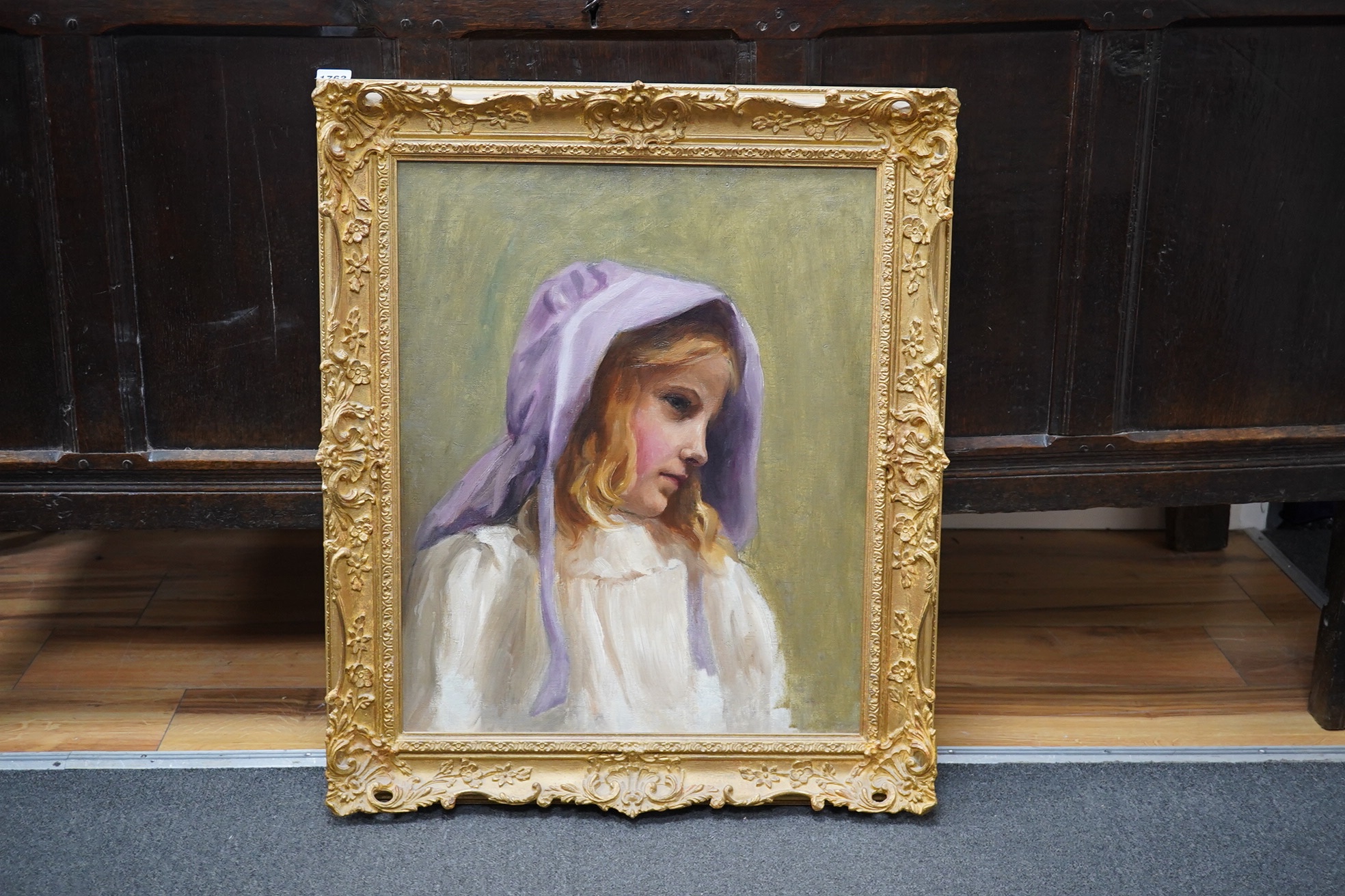 Early 20th century, English School, oil on canvas, Head and shoulders portrait of a young girl wearing a bonnet, unsigned, 54 x 44cm, ornately framed. Condition - good